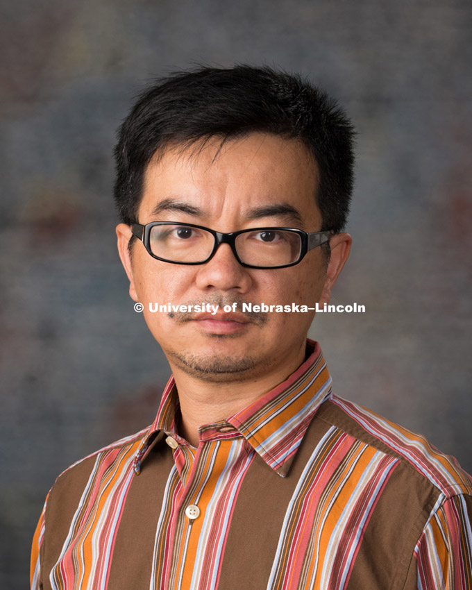 Studio portrait of Jiong Hu, New Faculty Photo Shoot, August 19, 2015. Photo by Greg Nathan, University Communications Photographer.