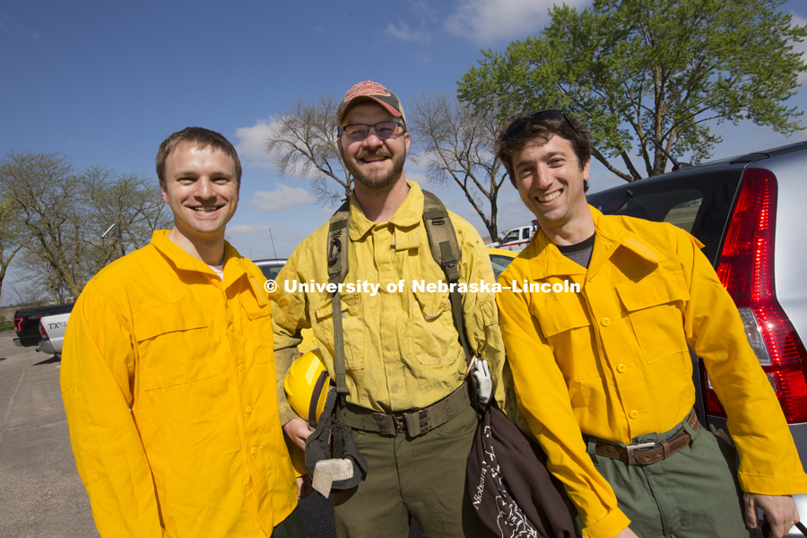 Carrick Detweiler, left, Dirac Twidwell and Sebastian Elbaum  before the controlled burn. Controlled burn at the Homestead National Monument in Beatrice, NE. Sebastian Elbaum and Carrick Detweiler have engineered a drone able to light controlled prairie burns using balls dropped from the sky. The drone injects a liquid into the plastic spheres to start a delayed fiery process so the balls can fall to the ground before igniting. Elbaum and Detweiler are Professors of computer science and engineering. Twidwell is an assistant professor and range land ecologist in the school of natural resources. April 22, 2015. Photo by Craig Chandler / University Communications