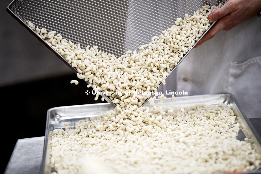 Test production of gluten-free macaroni noodles made with cricket protein. Kelly Sturek and Julianne Kopf are two thirds of the Bugeater Foods team working to use insect protein as a sustainable food source. The start up is using Food Innovation Campus to prefect their dream. February 16, 2017. Photo by Craig Chandler / University Communication.