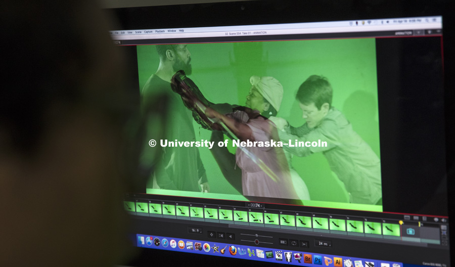A computer screen shows an image of Thalia Rodgers’ hand and brush as she creates an animation by painting over a live-action scene with a technique called rotoscoping. Rodgers is a student member of a team at Nebraska that is creating an animated film