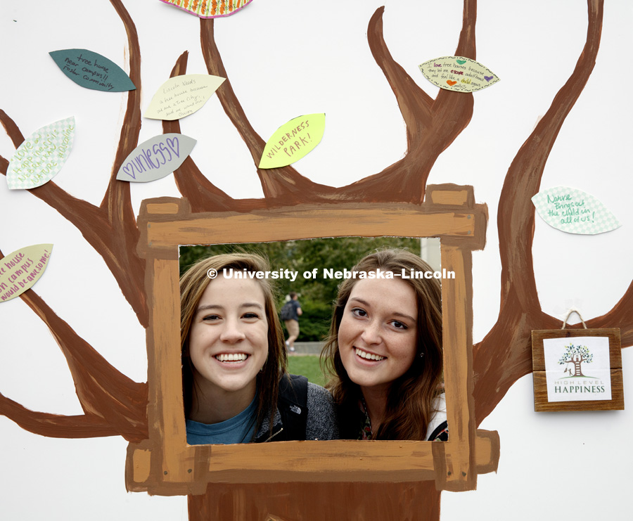 Morgahn Bruns and Alexis Philson pose in the High Level Happiness photo booth. High Level Happiness wants to build sustainable tree houses beginning in Lincoln. Earth Day celebration on city campus. April 21, 2017. Photo by Craig Chandler / University