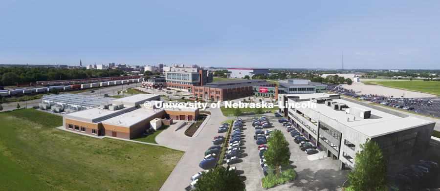 Photo illustration of new building on the Nebraska Innovation Campus combining artist rendering and drone aerial of site. June 7, 2017. Photo by Craig Chandler / University Communication.