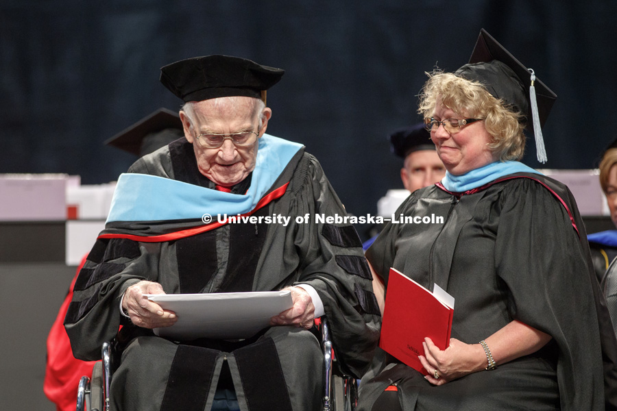 Roy Long receives an honorary Doctor of Education degree during the August Commencement at Pinnacle Bank Arena. Long is a 1947 Nebraska graduate whose college education was interrupted by World War 2 where he served in Patton's army, liberated a