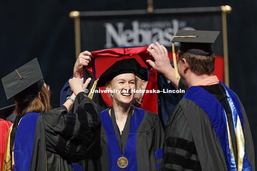 Michelle Howell smiles after her doctoral hood was placed over her head. August Commencement at Pinnacle Bank Arena. August 12, 2017. Photo by Craig Chandler / University Communication.