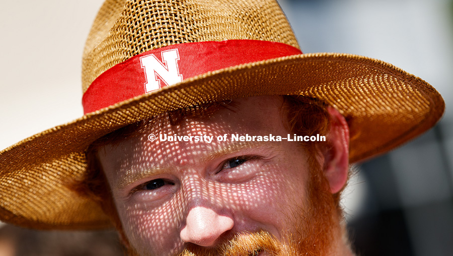 Colin Wooldrik's straw hat gives him solar freckles outside Memorial Stadium. Nebraska football vs. Arkansas State. September 2, 2017. Photo by Craig Chandler / University Communication.