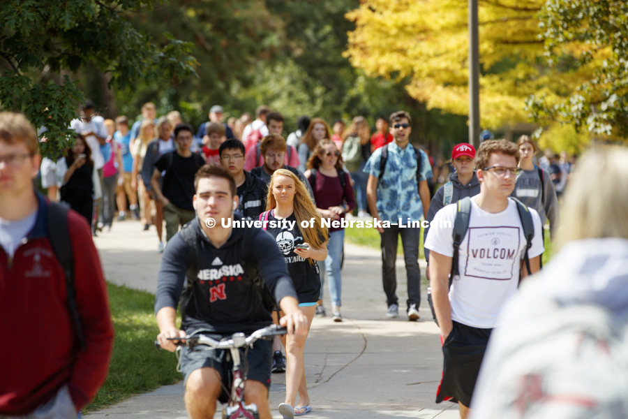 Students walk on city campus in between classes. September 5, 2017. Photo by Craig Chandler / University Communication.