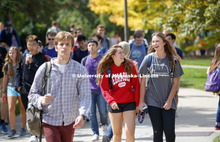 Lexi Wolfe and Emma Schumacher talk while walking near Hamilton Hall on their way back from class. September 5, 2017. Photo by Craig Chandler / University Communication.