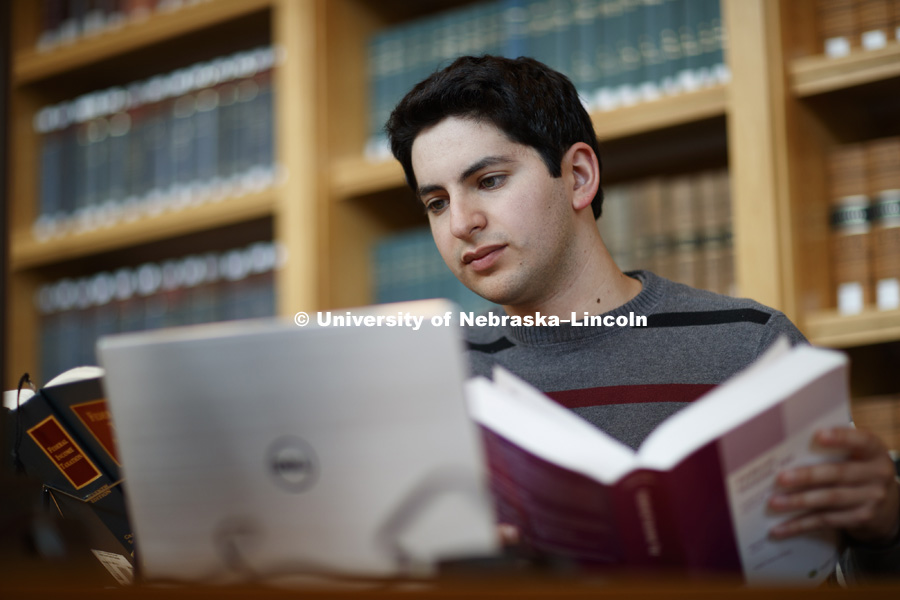 Daniel Segura studies in the law library. College of Law photo shoot. September 14, 2017. Photo by Craig Chandler / University Communication.