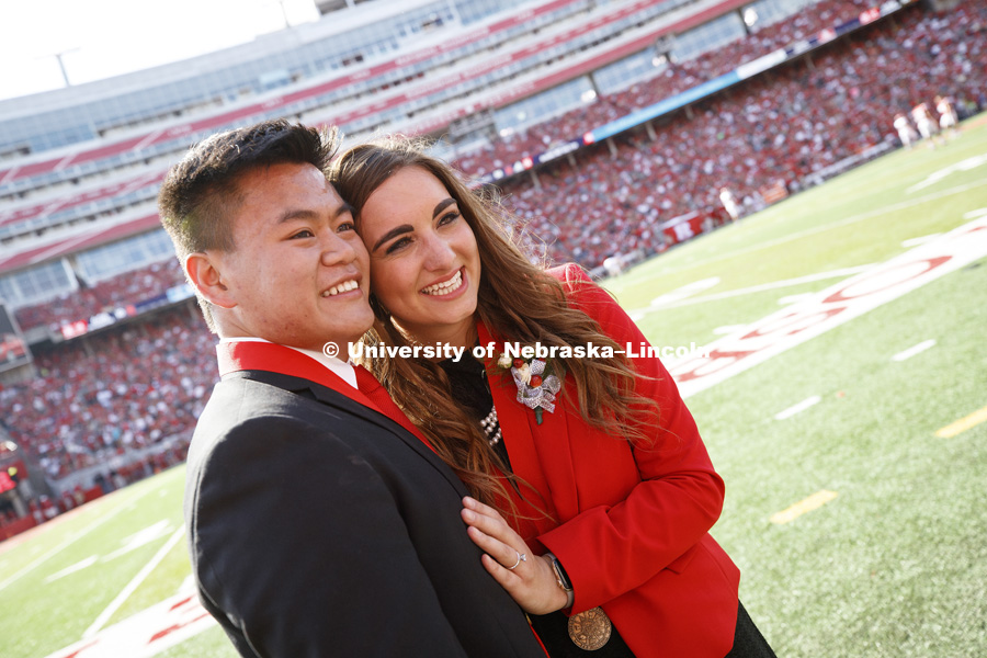 Newly engaged homecoming king and queen Shayne Arriola and Laura Springer pose for photos after the halftime ceremony and proposal. It was a memorable day for University of Nebraska-Lincoln seniors Shayne Arriola and Laura Springer, both of Grand Island.