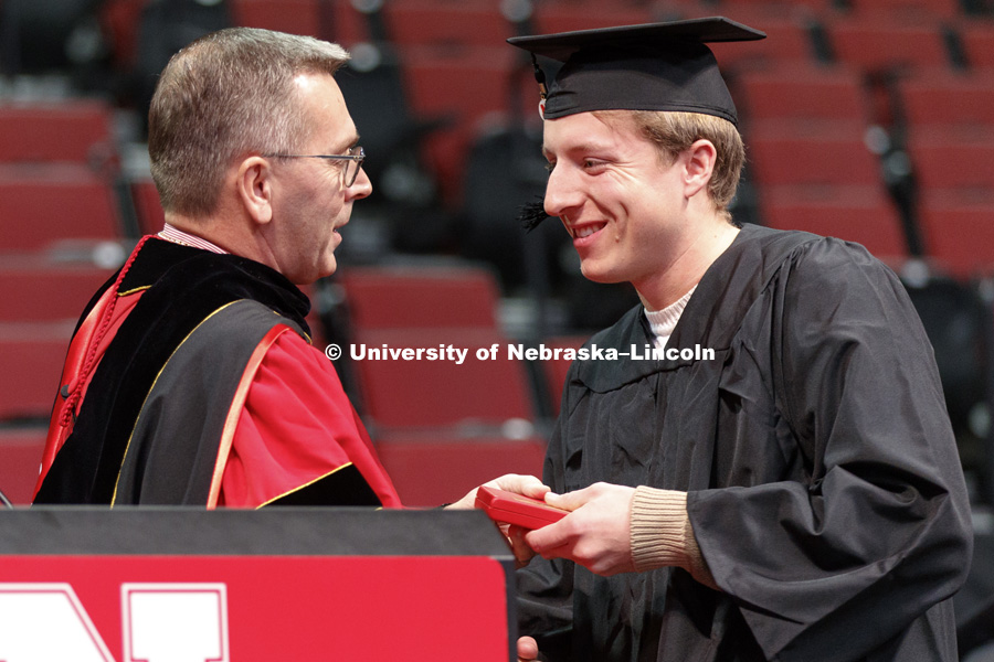 James B. Milliken, former president of the University of Nebraska system and chancellor of The City University of New York was awarded Nebraska's prestigious Cather Medal Saturday. Chancellor Ronnie Green presents the medal to Caleb Milliken, his son, who