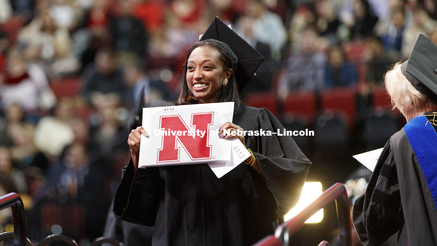 Gazmine Mason shows off her College of Business diploma. Undergraduate Commencement at Pinnacle Bank Arena. December 16, 2017. Photo by Craig Chandler / University Communication.