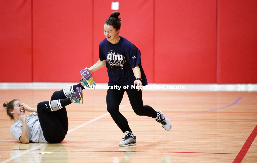 Miranda Fendrich unfreezes Emily Hetmanek during a game of tag. Masters students in TEAC 893 Seminar Workshop in Health & Physical Education apply learning principals to physical education games in Mabel Lee hall gymnasium.  January 12, 2018. Photo by