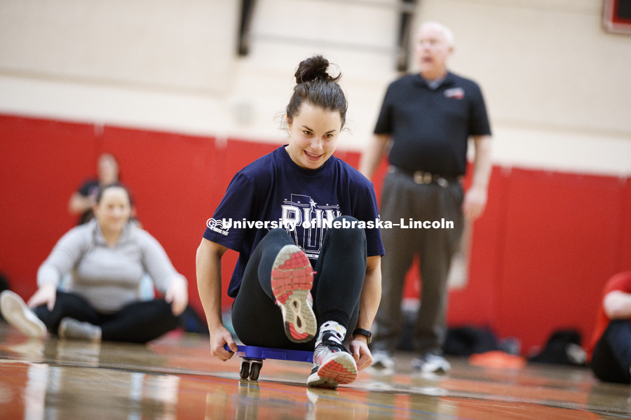 Miranda Fendrich works on her scooter techniques. Masters students in TEAC 893 Seminar Workshop in Health & Physical Education apply learning principals to physical education games in Mabel Lee hall gymnasium.  January 12, 2018. Photo by Craig Chandler /