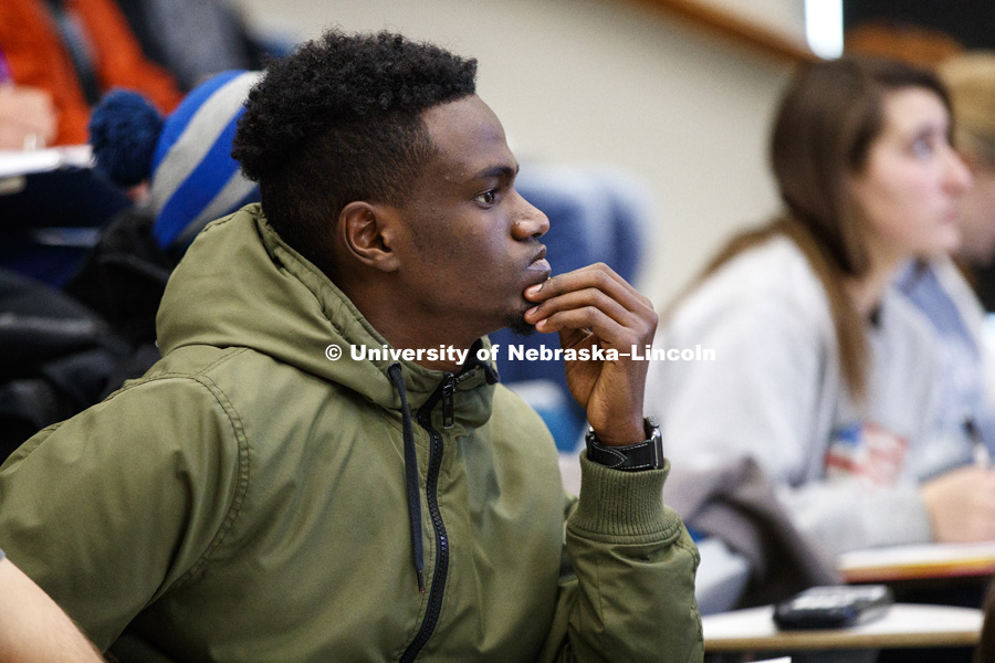 Student listens as Curtis Tomasevicz, former Husker football player, Gold medal Olympic bobsledder and Lecturer in Electrical & Computer Engineering teaches his CONE 206 - Engineering Economics in Brace Hall. February 6, 2018. Photo by Craig Chandler /