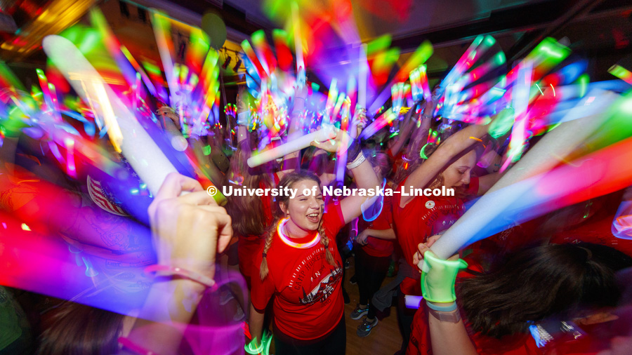 Phi Mu sorority members are surrounded by light wands and glow sticks on the Union Ballroom Saturday night. Phi Mu raised the most money of any group. 1274 Nebraska students signed up to be part of the Huskerthon Dance Marathon for Children's Hospital in
