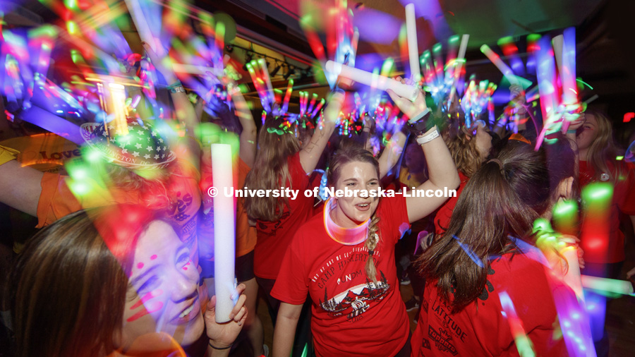 Phi Mu sorority members are surrounded by light wands and glow sticks on the Union Ballroom Saturday night. Phi Mu raised the most money of any group. 1274 Nebraska students signed up to be part of the Huskerthon Dance Marathon for Children's Hospital in