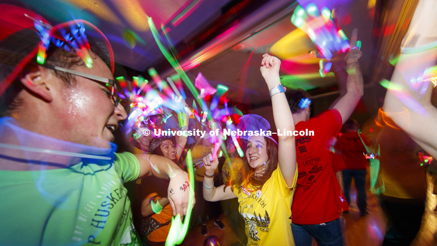 Joe Sherman and Taylor Rambo dance in the middle of a light show Saturday night. 1274 Nebraska students signed up to be part of the Huskerthon Dance Marathon for Children's Hospital in Omaha. February 17, 2019. Photo by Craig Chandler / University
