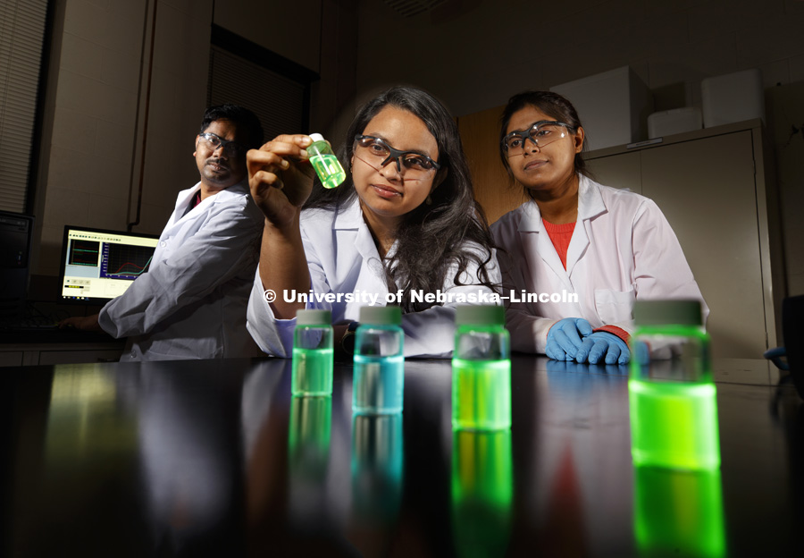 Shudipto Dishari (middle), assistant professor of Chemical and Bimolecular Engineering at UNL, in her lab with her students, exploring fluorescent dyes that she will use to track the movement of charged particles across nano thin polymeric materials using