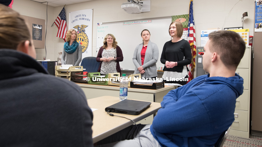 Researchers graduate student Rachel Ibach (purple sweater), Julie Obermeyer (grey sweater), and Jenny Keshwani (black shirt) talk at a Crete High School with students about STEM career fields. March 26, 2018. Photo by Greg Nathan, University Communication.