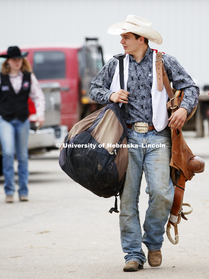 Gage Kraeger carries his gear into the arena. 60th anniversary of the University of Nebraska-Lincoln Rodeo Club. April 20, 2018. Photo by Craig Chandler / University Communication.