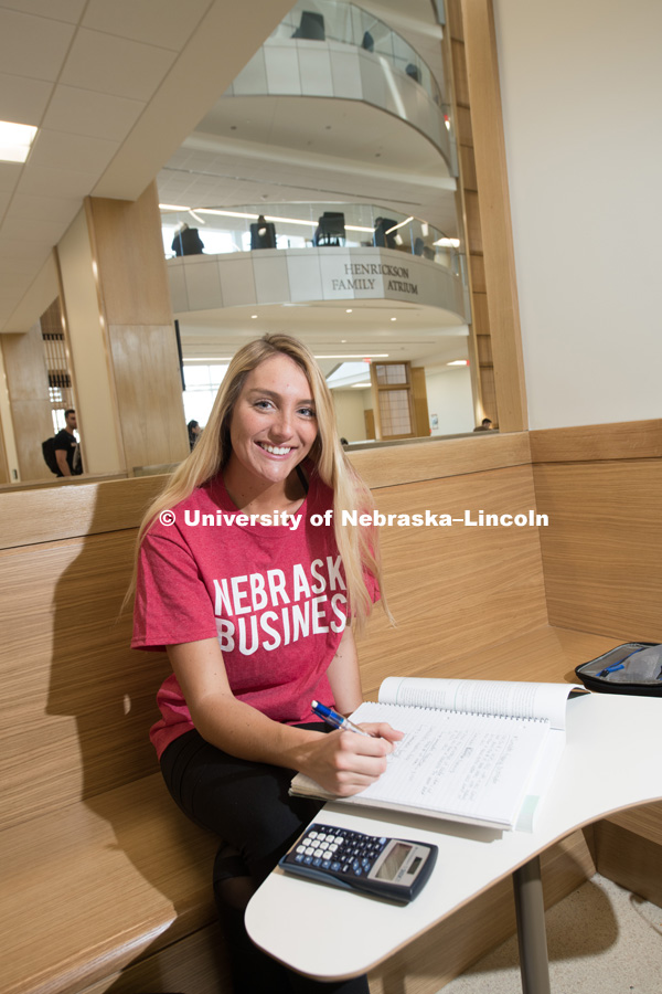College of Business photo shoot. Meggan Andrati works on homework in a commons / study area of the new College of Business. April 25, 2018. Photo by Greg Nathan, University Communication Photography.