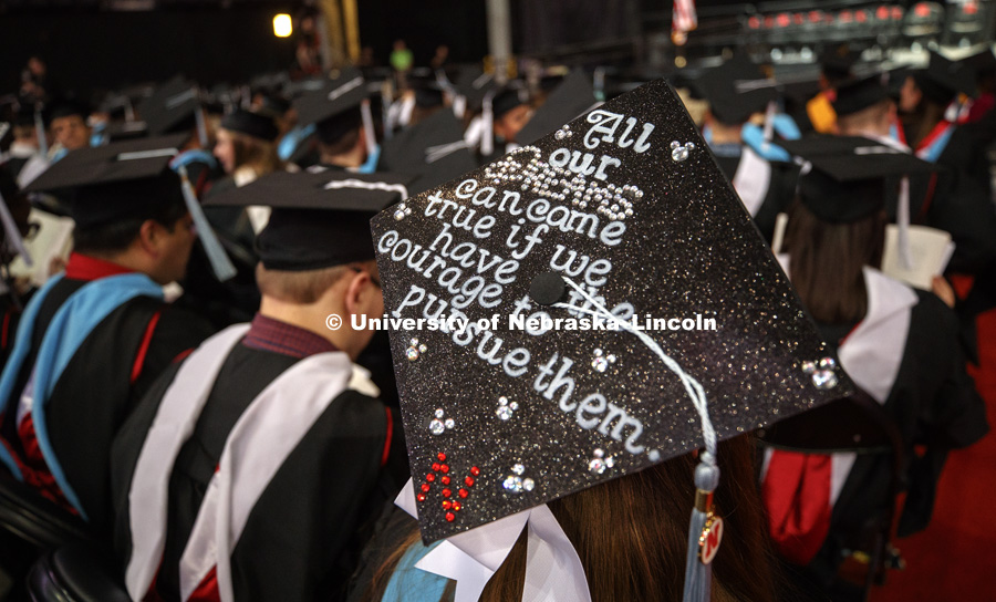 Katarina Sickle wears her thoughts on her mortarboard at Graduate Commencement in Pinnacle Bank Arena. May 4, 2018. Photo by Craig Chandler / University Communication.