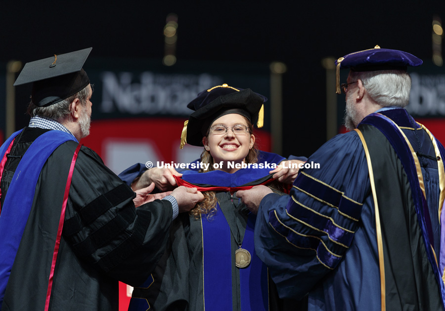 Andrea Matthews receives her doctoral hood in Business. Graduate Commencement at Pinnacle Bank Arena. May 4, 2018. Photo by Craig Chandler / University Communication.