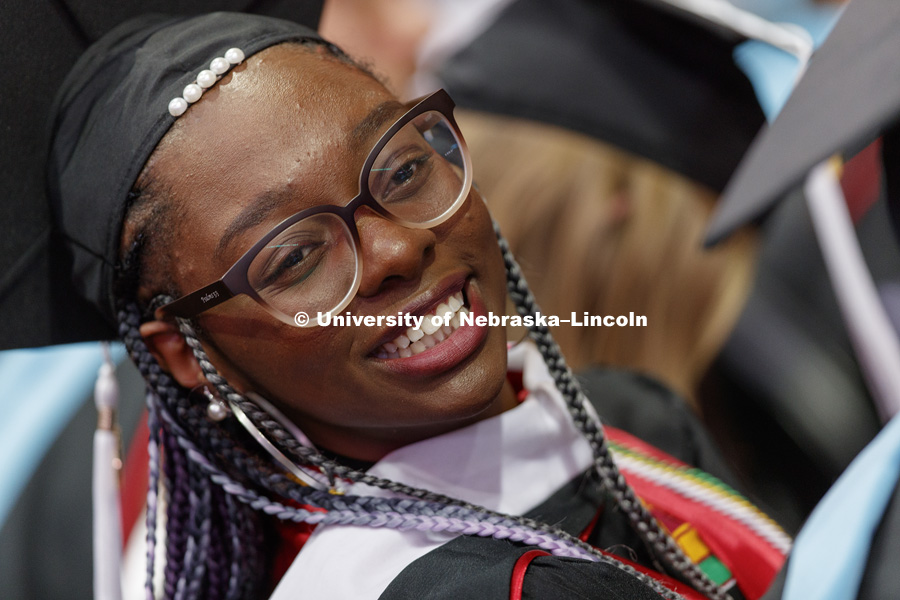 Mecca Slaughter looks up to her family and friends in the arena. Graduate Commencement at Pinnacle Bank Arena. May 4, 2018. Photo by Craig Chandler / University Communication.
