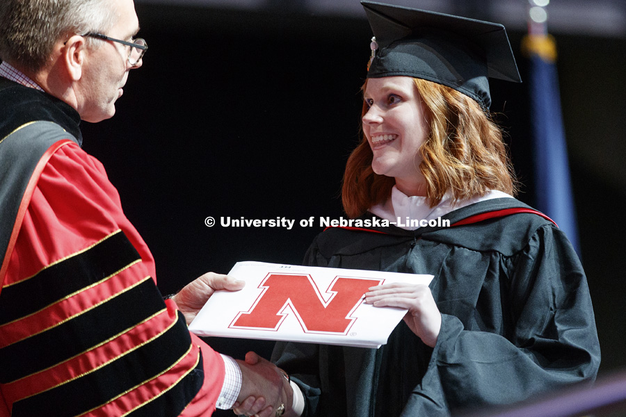 Allison Inglebright is congratulated by Chancellor Ronnie Green as she receives her master of journalism and mass communication. Graduate Commencement at Pinnacle Bank Arena. May 4, 2018. Photo by Craig Chandler / University Communication.