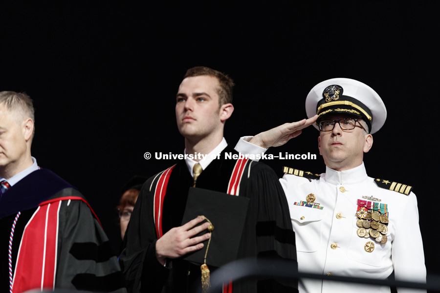 U.S. Navy Captain Richard Thomas salutes the flag at the Undergraduate Commencement at Pinnacle Bank Arena. May 5, 2018. Photo by Craig Chandler / University Communication.