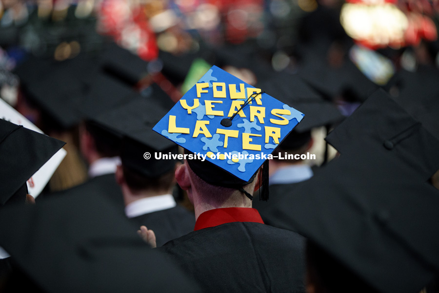 One decorated mortarboard reads, Four Years Later. Undergraduate Commencement at Pinnacle Bank Arena. May 5, 2018. Photo by Craig Chandler / University Communication.