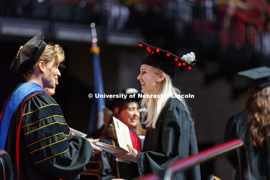 Alexa Davis' mortarboard lights up Undergraduate Commencement at Pinnacle Bank Arena. May 5, 2018. Photo by Craig Chandler / University Communication.