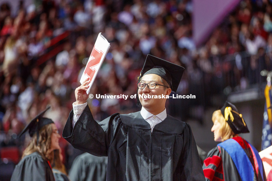 Tian Gao celebrates his College of Business degree. Undergraduate Commencement at Pinnacle Bank Arena. May 5, 2018. Photo by Craig Chandler / University Communication.