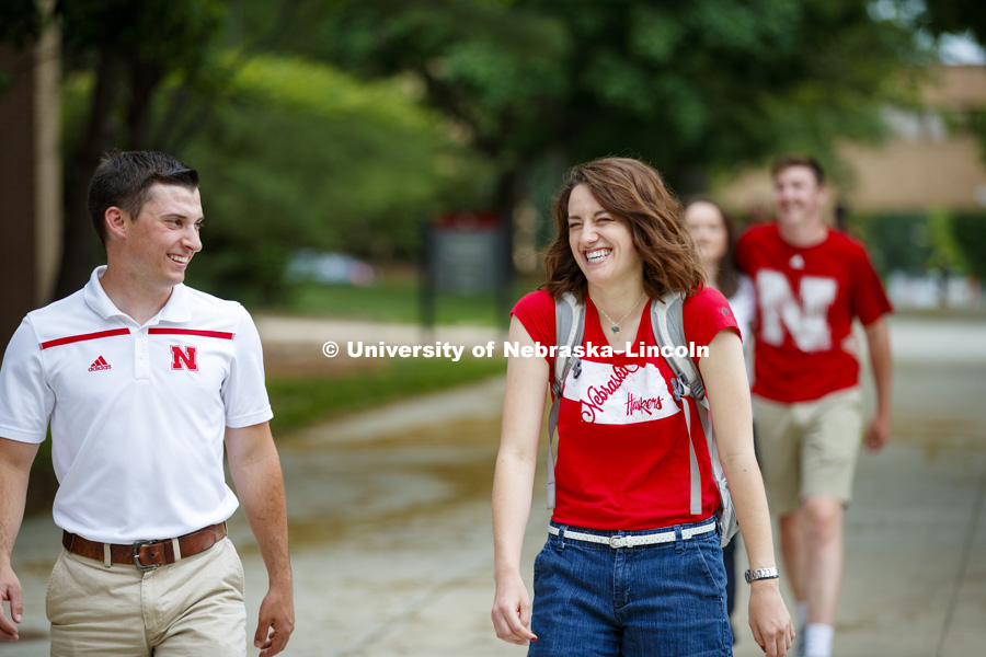 Students laughing and talking together as they cross East Campus. CASNR photo shoot on East Campus. May 29, 2018. Photo by Craig Chandler / University Communication.