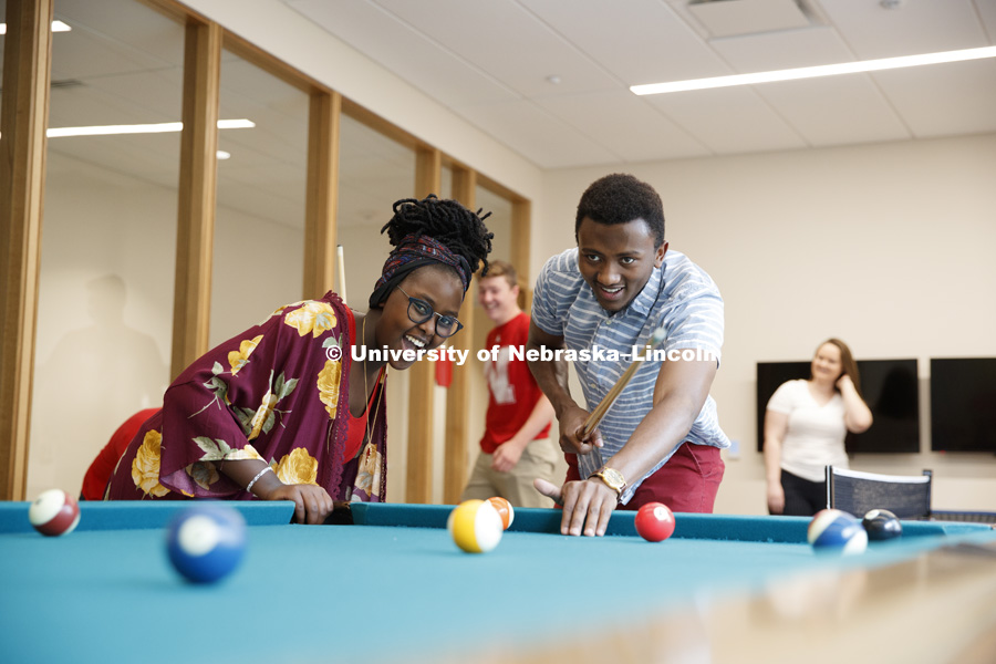 Students play a game of pool in the Massengale Residence Hall. CASNR photo shoot on East Campus. May 29, 2018. Photo by Craig Chandler / University Communication.