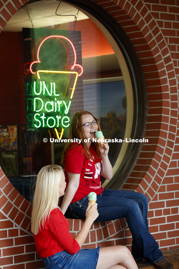 Students hang out in front the Dairy Store and enjoy a scoop of ice cream. CASNR photo shoot on East Campus. May 29, 2018. Photo by Craig Chandler / University Communication.