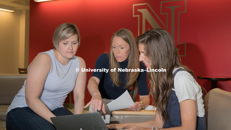 Lindsay Hastings (dark blue shirt) with graduate students Kate McCain (light grey shirt) and Hannah Sunderman. Lindsay is studying the ripple effect of generative leadership: how the transfer of leadership and wealth will affect Nebraska. She is an assistant professor for the Nebraska Human Resources Institute and Director of Agricultural Leadership, Education and Communication. Photo for the 2018 publication of the Strategic Discussions for Nebraska magazine. June 5, 2018. Photo by Greg Nathan, University Communication.