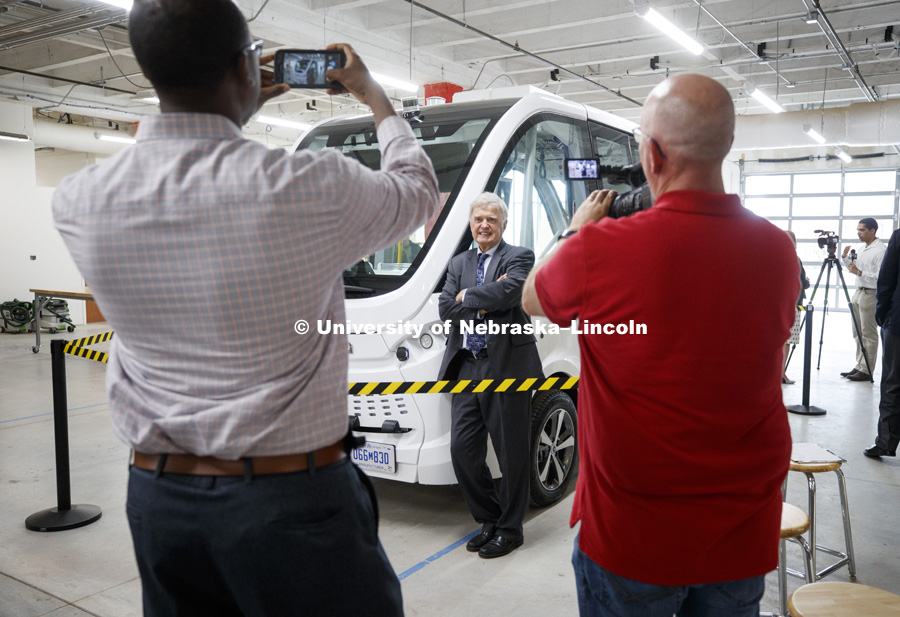 Lincoln Mayor Chris Beutler poses for photos following the press conference. The automated electric Navya (NAHV-yah) shuttle is displayed at Nebraska Innovation Campus. June 20, 2018. Photo by Craig Chandler / University Communication.