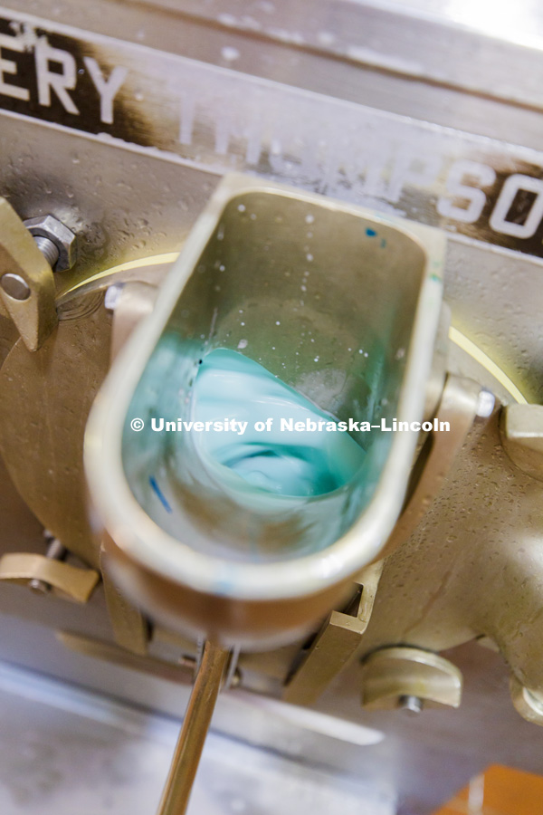 Shark Week ice cream mixes in the machine. Dairy Store making Shark Week ice cream with gummy sharks in a light blue ice cream. July 18, 2018. Photo by Craig Chandler / University Communication.