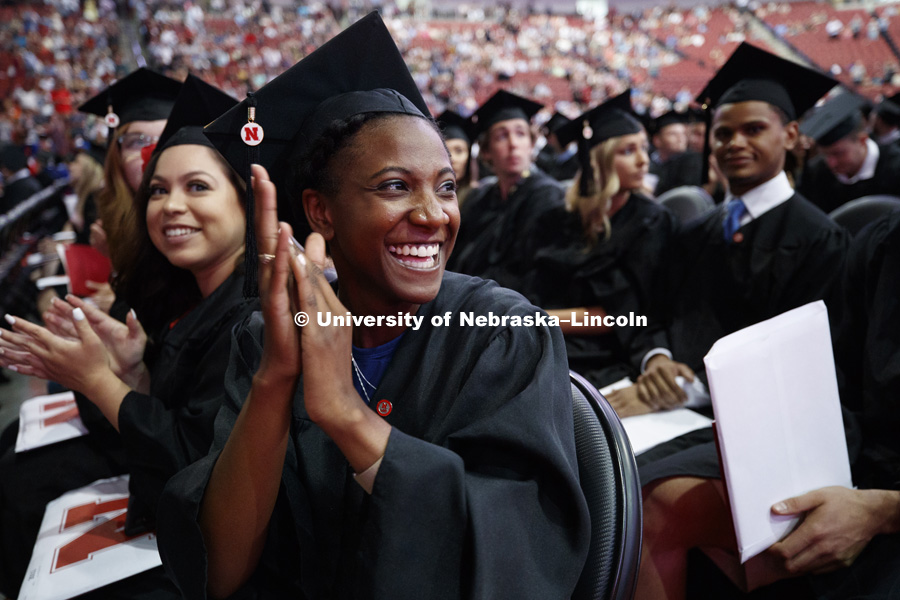 Kristen Dowell applauds her family and friends for their support in helping her reach her goal. Summer Commencement at Pinnacle Bank Arena. August 11, 2018. Photo by Craig Chandler / University Communication.