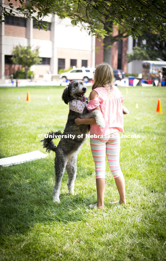 A girl teachers her dog new tricks during the Husker Dog fest on August 11, 2018 on the University of Nebraska-Lincoln Campus. Photo by Alyssa Mae for University Communication.