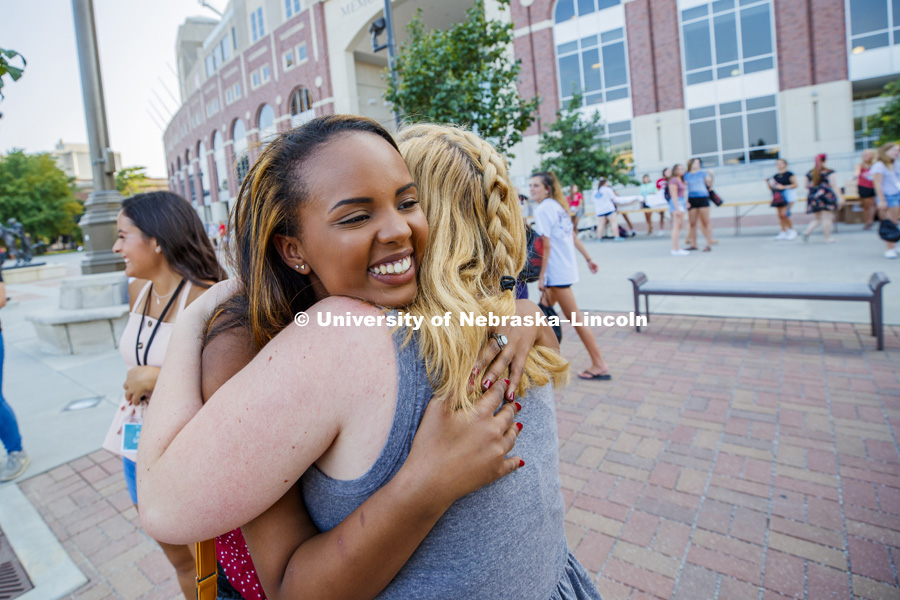 Henon Abraham hugs Elisabeth Oberle at Sorority recruitment check in and information meetings. August 12, 2018. Photo by Craig Chandler / University Communication.