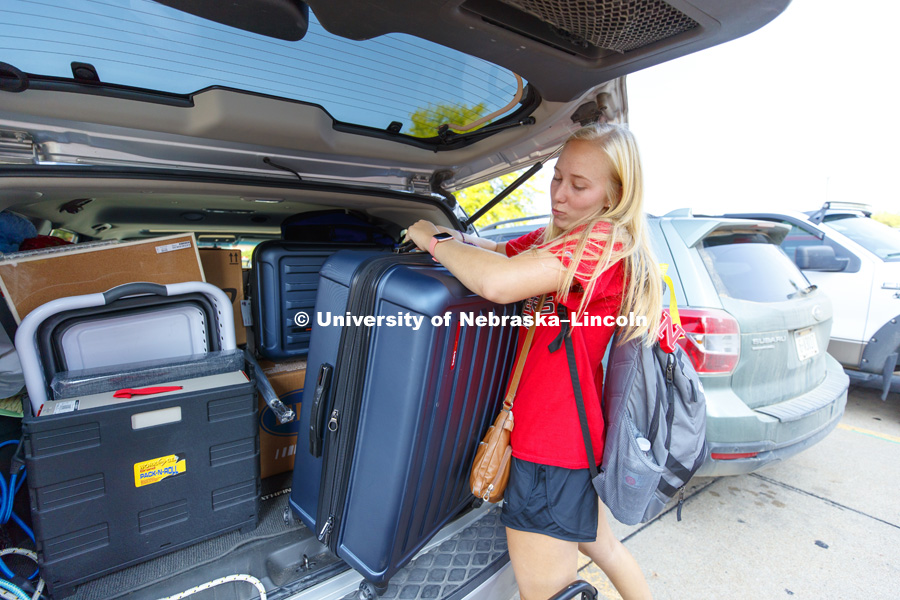 Sofia Heggem, of Lago Vista, Texas, unloads as she moves into her room Thursday morning. Residence Hall move-in. August 16, 2018. Photo by Craig Chandler / University Communication.