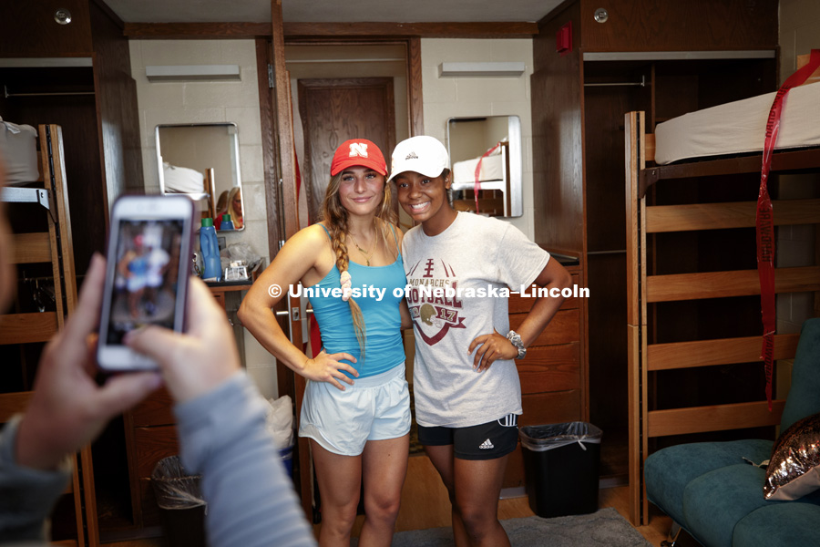 Roommates Analiese Raley, from Clovis, California, left, and Courtney Wallace, from Omaha, and pose for photos in their Smith Hall room. The roommates are also on the Husker Softball team. Residence Hall move-in. August 16, 2018. Photo by Craig Chandler /
