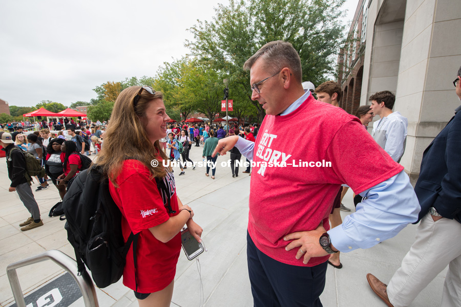 Chancellor Ronnie Green stops to talk to a student at the Brand Launch. In Our Grit, Our Glory brand reveal party on city campus at the Nebraska Union. August 30, 2018. Photo by Greg Nathan, University Communication.