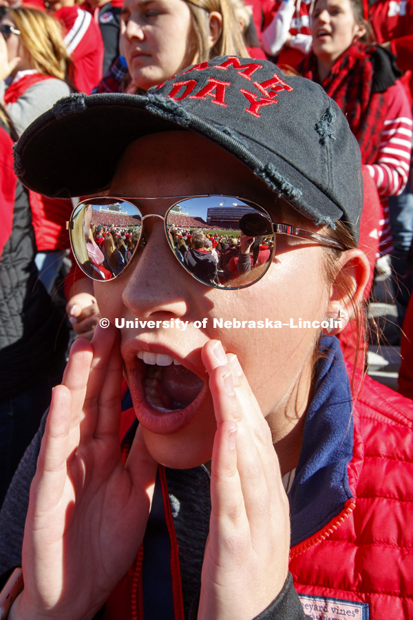 The stadium is reflected in Maddie Luebe's sunglasses. She is from Columbus, Nebraska. Nebraska vs. Minnesota football. October 20, 2018. Photo by Craig Chandler / University Communication.