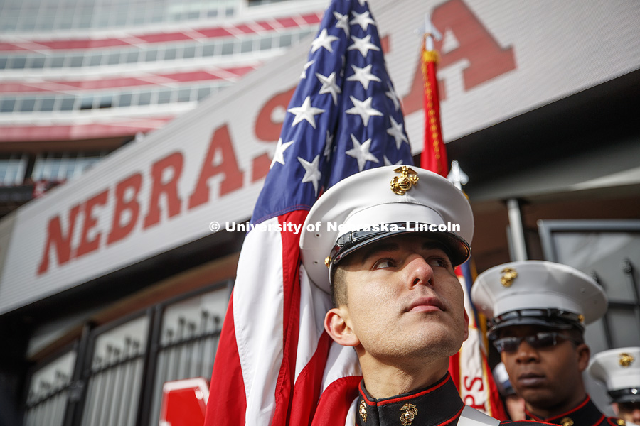 Sgt Miguel Aguirre, a member of an active duty Marine color guard, looks around Memorial Stadium as the color guards wait for the pregame ceremonies. Nebraska vs. Illinois football in Memorial Stadium. November 10, 2018. Photo by Craig Chandler / University Communication.