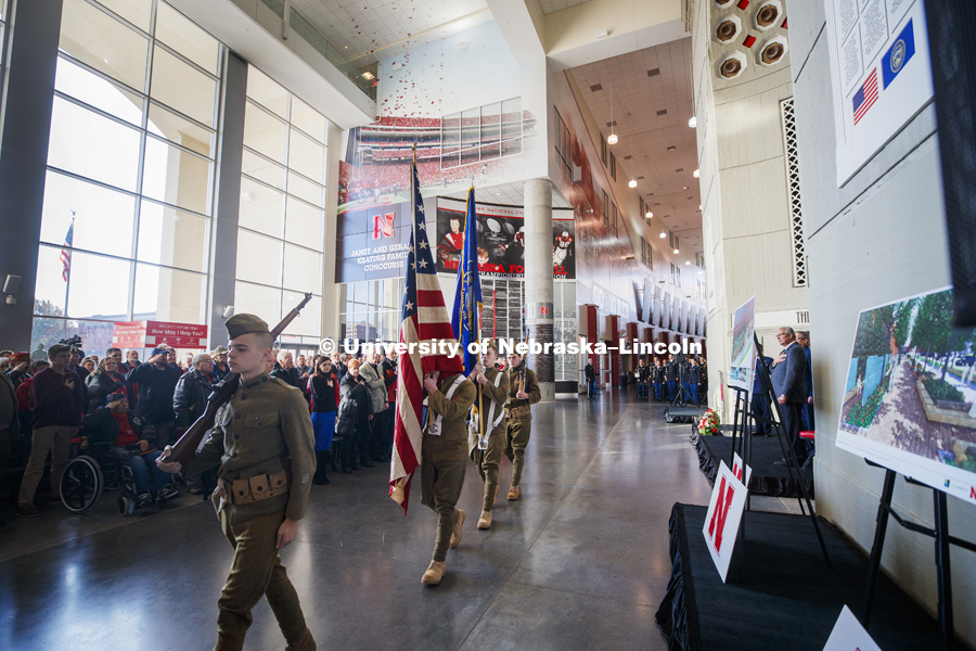 The colors are retired at the end of the ceremony. At right are renderings for the new veterans tribute area planned for near Nebraska’s Pershing Military and Naval Science Building. A new display commemorating the World War I service of Nebraskans and University of Nebraska students was dedicated during a November 11 ceremony at Memorial Stadium. November 11, 2018. Photo by Craig Chandler / University Communication.