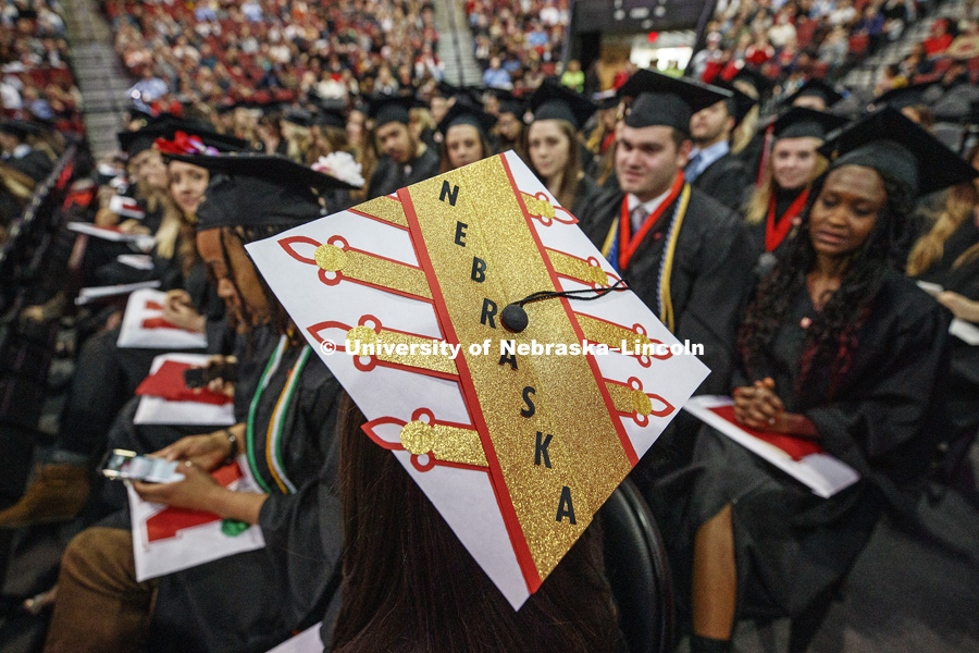 Mary Morrison, a piccolo player in the Cornhusker Marching Band, decorated her mortarboard for her final appearance before a crowd at UNL. Undergraduate Commencement in Pinnacle Bank Arena. December 15, 2018. Photo by Craig Chandler / University Communication.