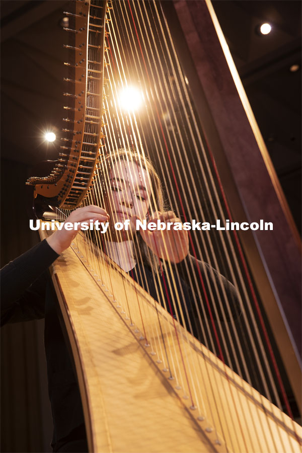 Sarah Brady plays the new harps on the Kimball Hall stage. The Glenn Korff School of Music is building its harp program thanks to the recent purchase of two Lyon and Healy harps, one of which was purchased with support from a generous donor. January 28, 2019. Photo by Craig Chandler / University Communication